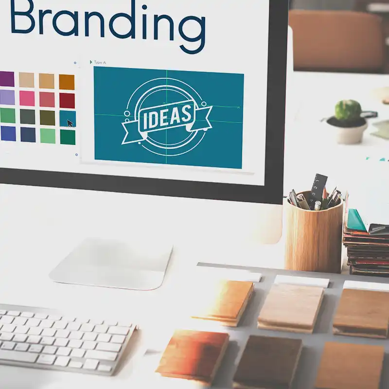 Computer screen showing branding design with color palette, highlighting Artmedia Digital’s brand guidelines development process.