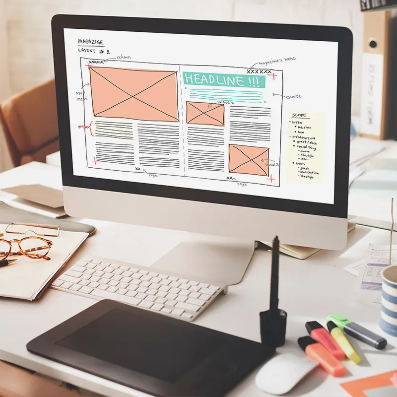 Strategic landing page design process on a desktop monitor, featuring a clear layout with headline, image placeholders, and text blocks, demonstrating Artmedia Digital's focus on conversion.