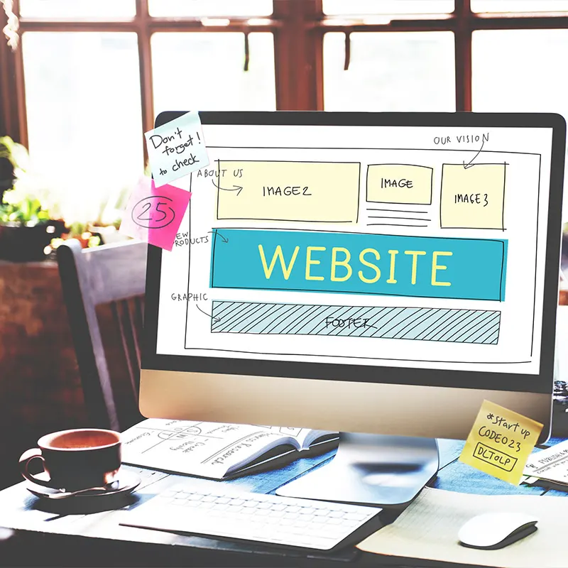 Website design layout displayed on a computer screen, showing wireframes and content blocks by Artmedia Digital.